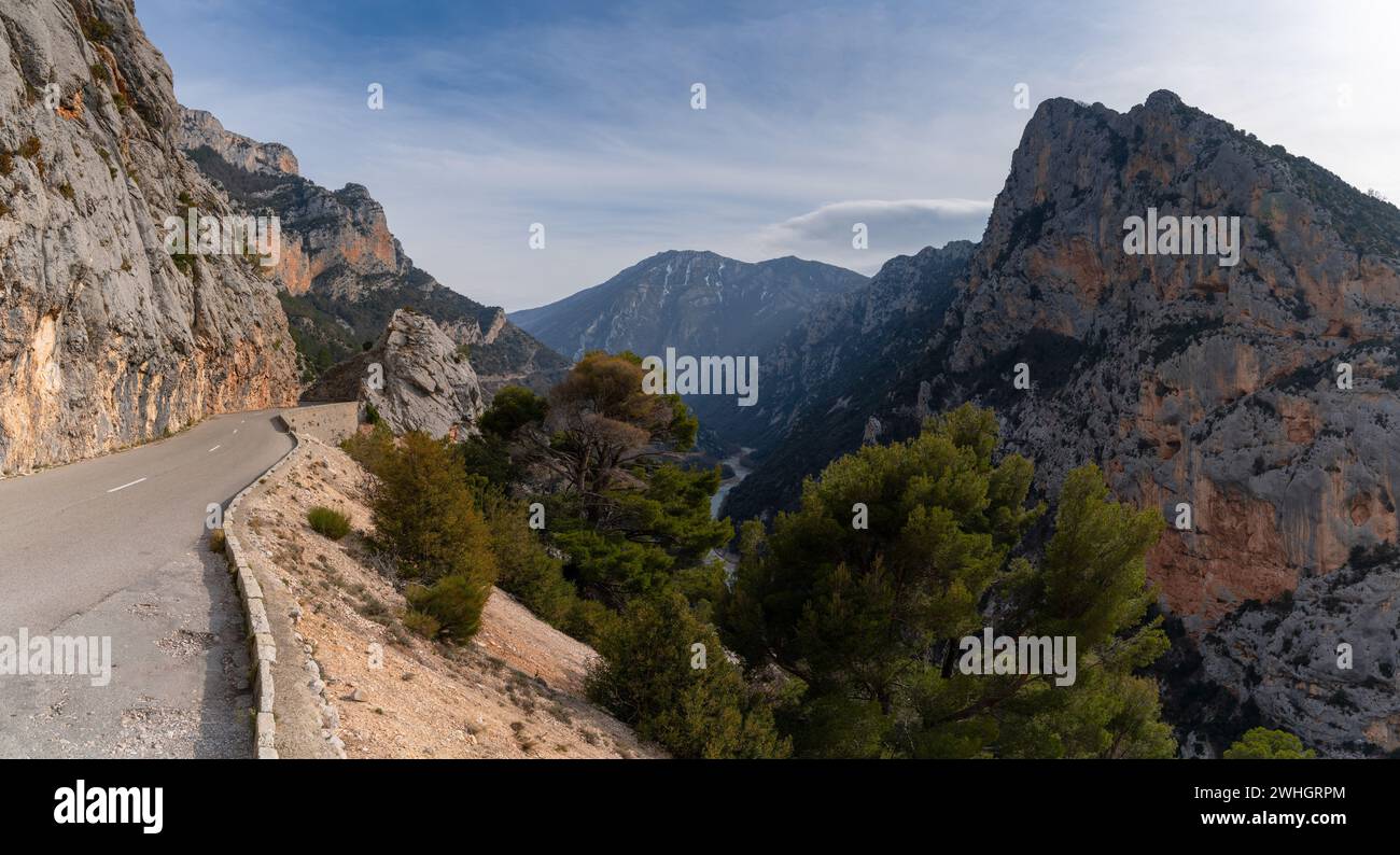 A narrow mountain road leads into the wild and rugged landscape of the Verdon Gorge in southeastern France Stock Photo
