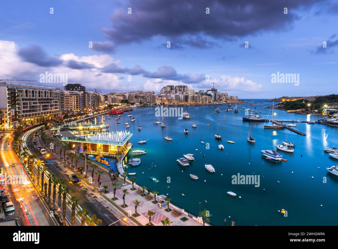 Evening at Sliema Bay promenade in Malta. Illuminated cityscape Stock Photo