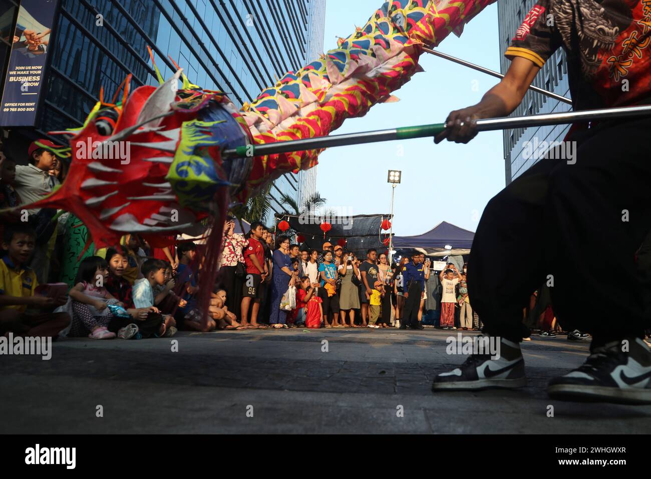 Local Chinese artists perform a dragon dance during a cerebration to ...