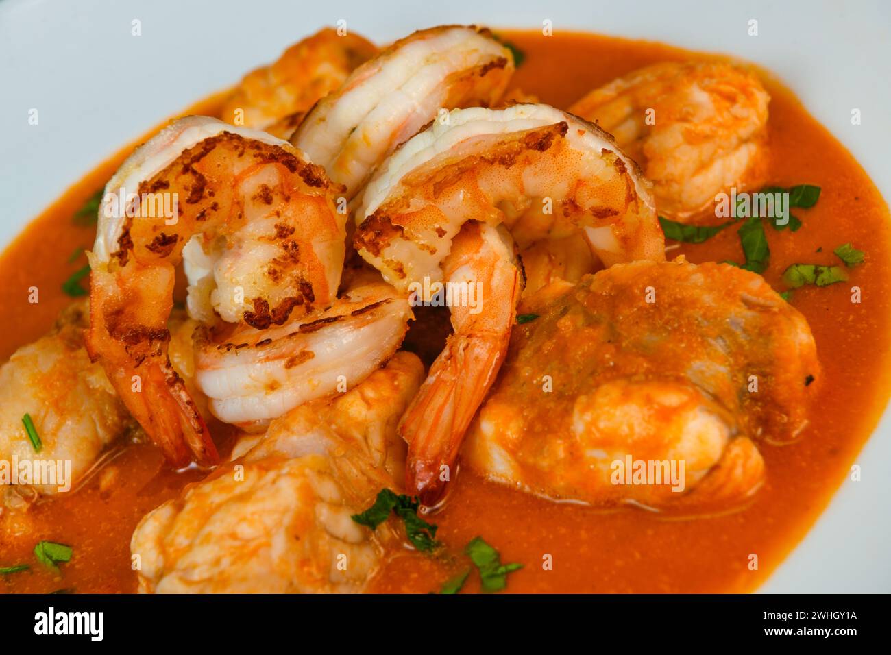 Recipe for Armorican-style monkfish tail, prawns, flambees with cognac Stock Photo