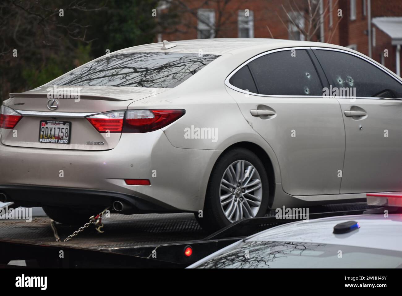 Temple Hills, Maryland, USA. 10th Feb, 2024. (NEW) Vehicle where deceased victim found, towed away. Two people shot, one person dead in a shooting in Temple Hills, Maryland. February 10, 2024, Temple Hills, Maryland, USA: At approximately 4:05 a.m., Saturday officers responded to the 2300 Block of Iverson St for a shooting. On scene, police discovered an adult male outside suffering from gunshot wounds and he was taken to the hospital in stable condition. Police officers then responded to the 2400 Block of Iverson St and located an adult male in a vehicle suffering from gunshot wounds and h Stock Photo