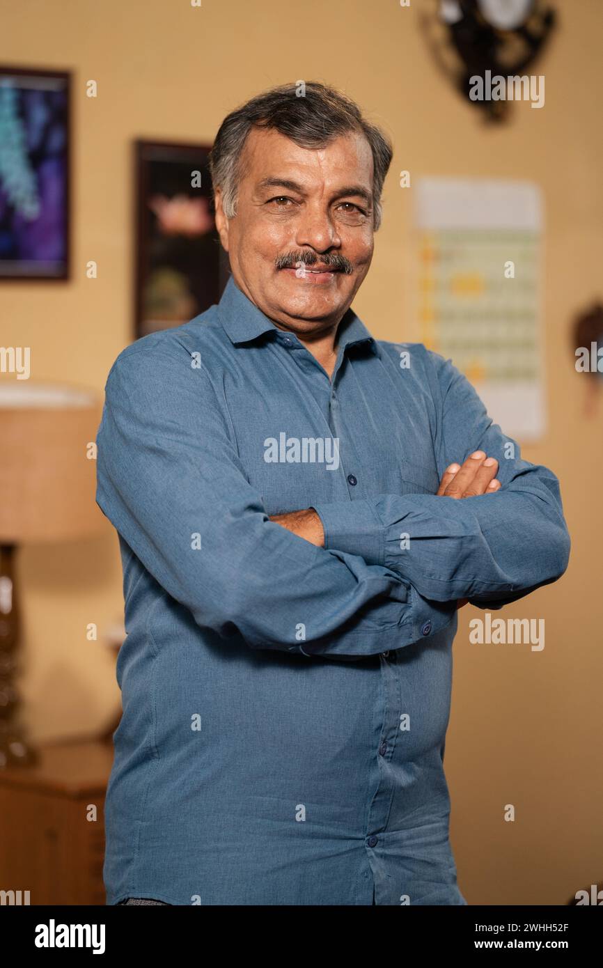 Indian man standing confidently hi-res stock photography and images - Alamy