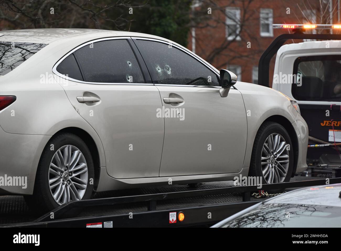Temple Hills, Maryland, USA. 10th Feb, 2024. (NEW) Vehicle where deceased victim found, towed away. Two people shot, one person dead in a shooting in Temple Hills, Maryland. February 10, 2024, Temple Hills, Maryland, USA: At approximately 4:05 a.m., Saturday officers responded to the 2300 Block of Iverson St for a shooting. On scene, police discovered an adult male outside suffering from gunshot wounds and he was taken to the hospital in stable condition. Police officers then responded to the 2400 Block of Iverson St and located an adult male in a vehicle suffering from gunshot wounds and h Stock Photo
