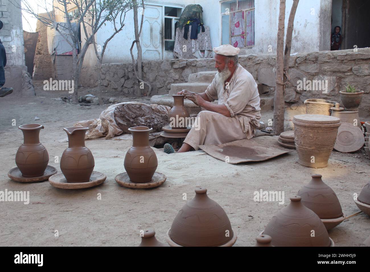 Laghman, Afghanistan. 10th Feb, 2024. An Afghan worker makes pots at a pottery factory in Laghman Province, Afghanistan, Feb. 10, 2024. Credit: Aimal Zahir/Xinhua/Alamy Live News Stock Photo
