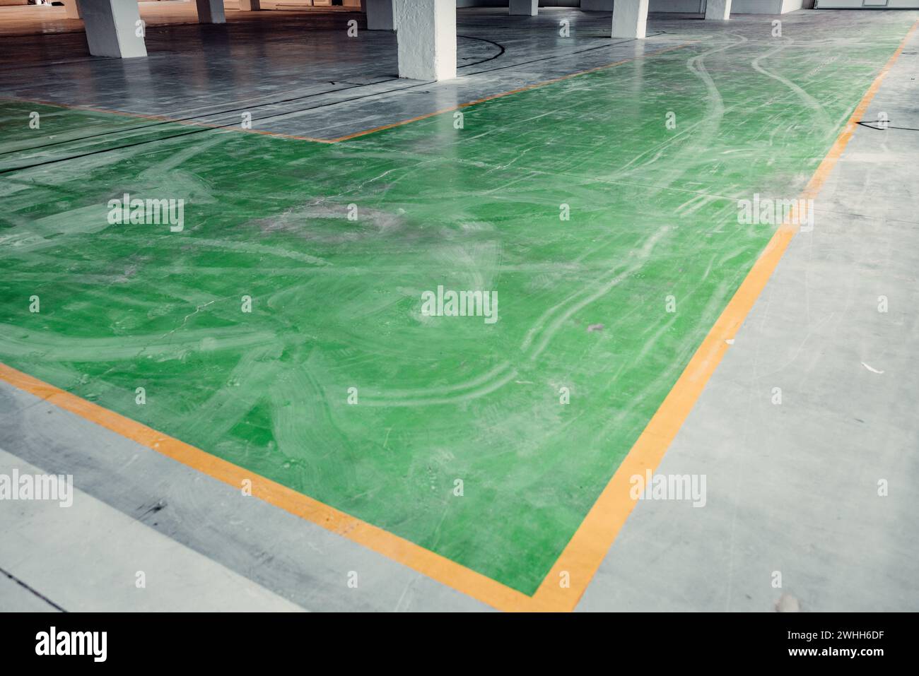 View of Interior of a warehouse with old floor that needs to be refurbished ...