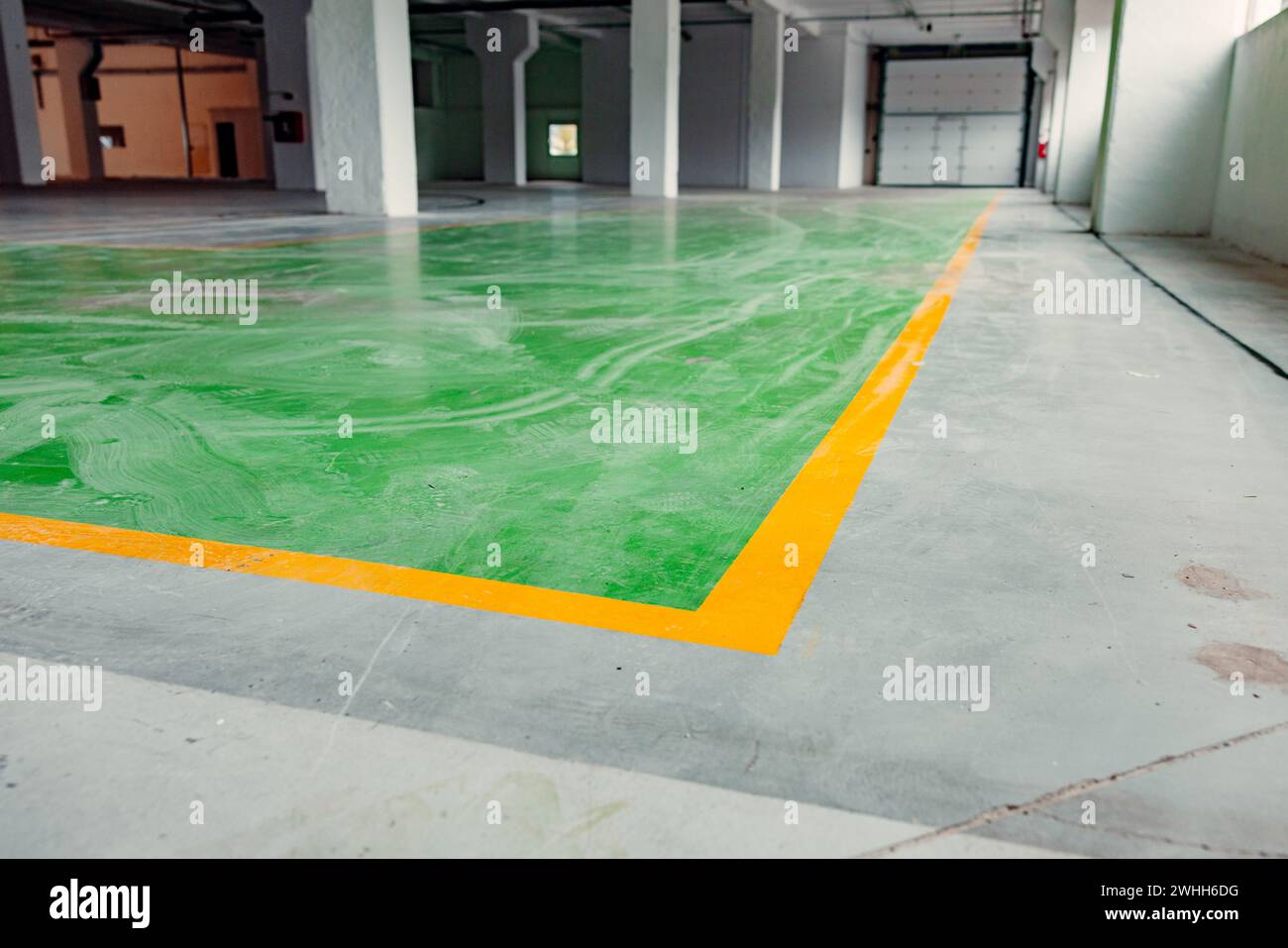 View of Interior of a warehouse with old floor that needs to be refurbished ...