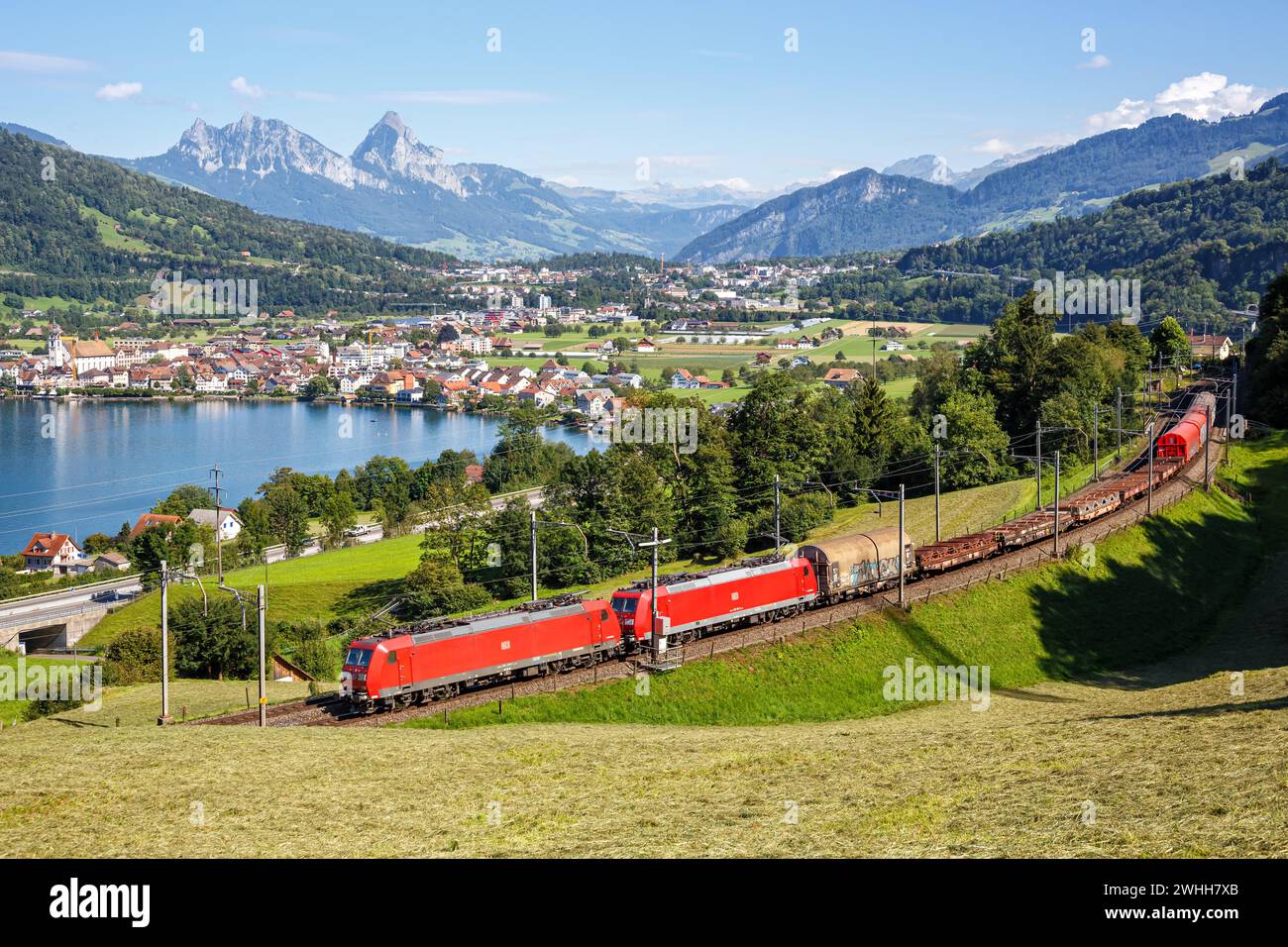 Arth, Switzerland - August 10, 2023: Railway Freight Train Of The DB Cargo At The Mountain Grosser Mythen Am Zugersee In The Alps In Arth, Switzerland Stock Photo