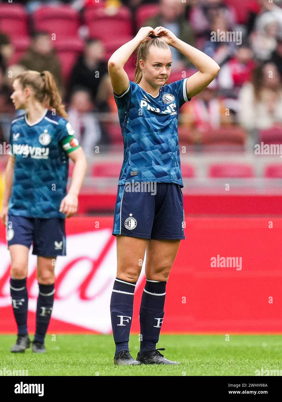 Amsterdam, Netherlands. 10th Feb, 2024. Amsterdam - Amber Verspaget of Feyenoord V1 reacts to the 4-0 during the match between Ajax V1 v Feyenoord V1 at Johan Cruijff Arena on 10 February 2024 in Amsterdam, Netherlands. Credit: box to box pictures/Alamy Live News Stock Photo
