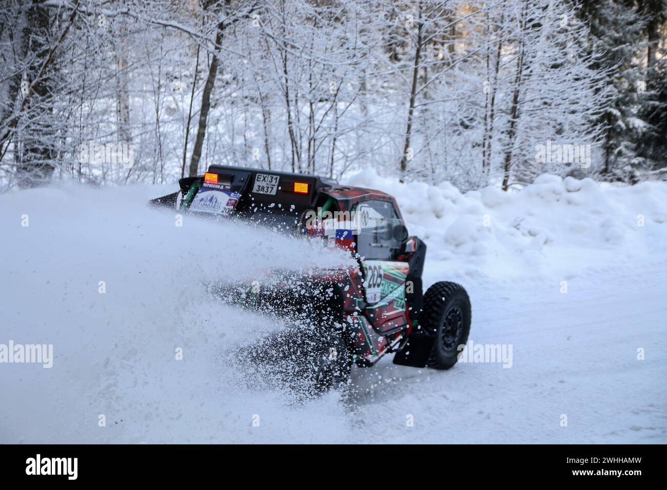 Leningrad Region, Russia. 10th Feb, 2024. Dmitry Cherkesov/Vladimir Prostakov (205) racing crew compete during 1st stage of the Russian Baja Rally Raid Championship “Russia Northern Forest”. Credit: SOPA Images Limited/Alamy Live News Stock Photo