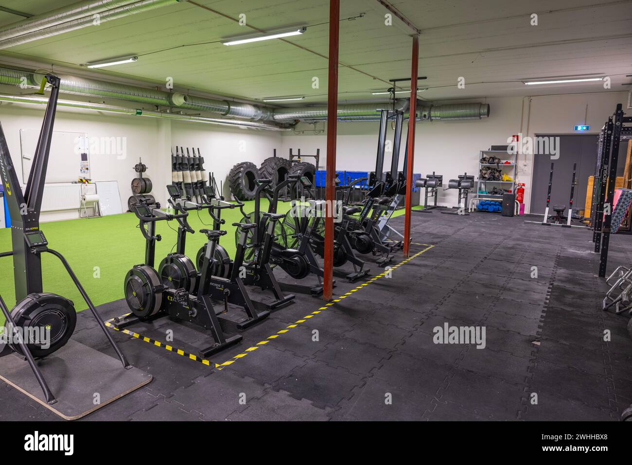 Gym equipped with various strength machines, promoting a healthy lifestyle. Stock Photo