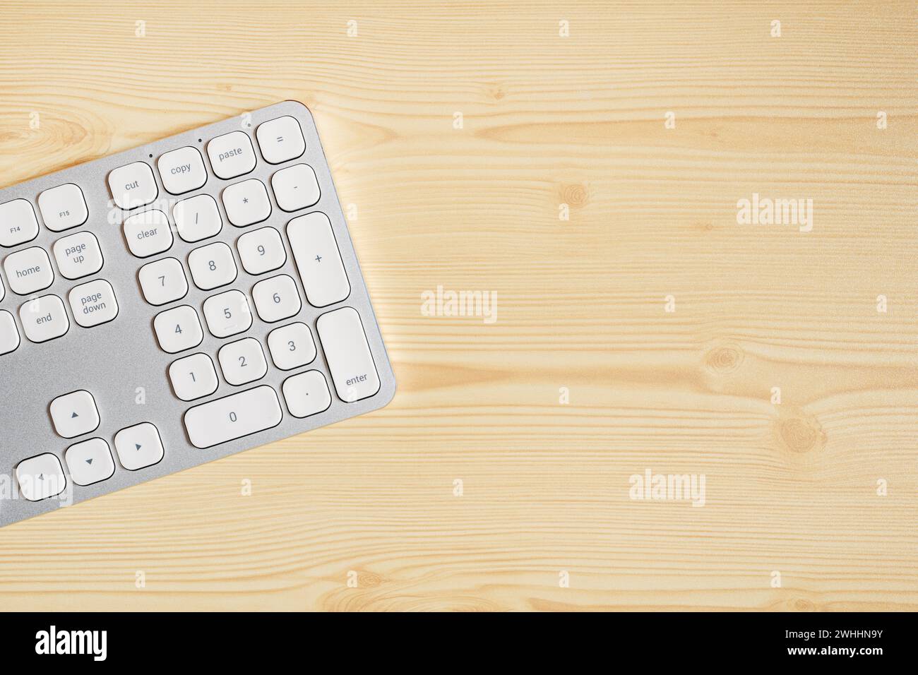 Computer keyboard on wooden office desk, top view Stock Photo