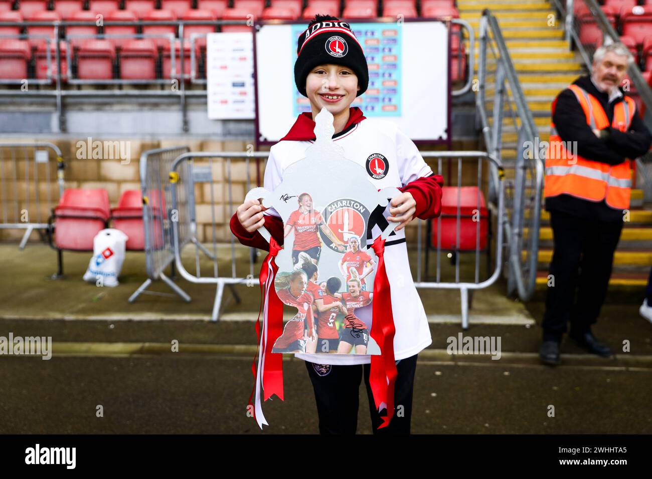 A Charlton Athletic supporter holds a cut-out trophy adorned with Charlton players during the Womens FA Cup game between Tottenham Hotspur and Charlton Athletic at Gaughan Group Stadium Brisbane Road in London, England. (Liam Asman/SPP) Credit: SPP Sport Press Photo. /Alamy Live News Stock Photo