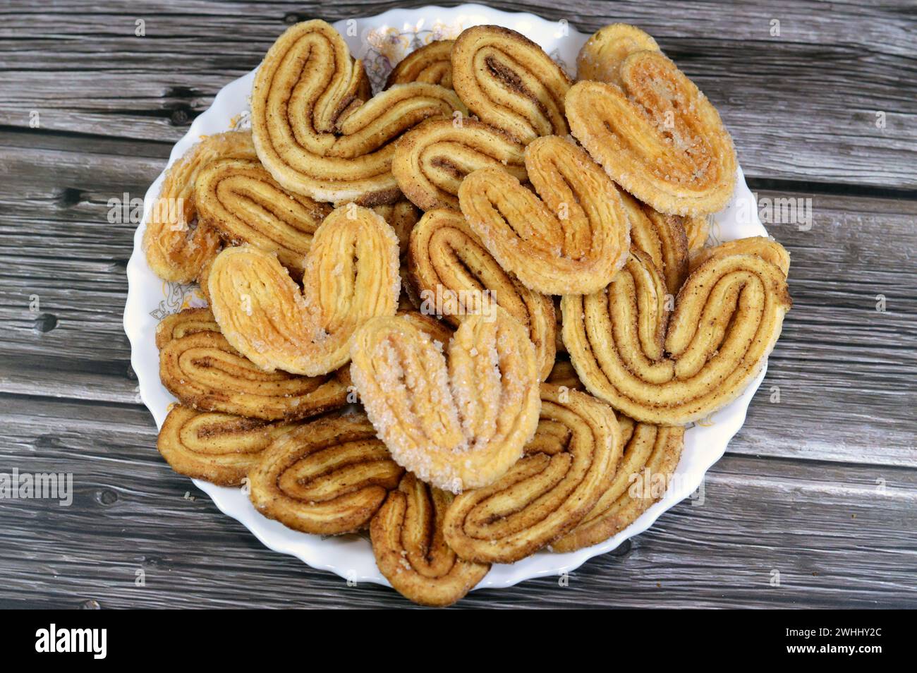 palmier, short for feuille de palmier 'palm tree leaf, French hearts