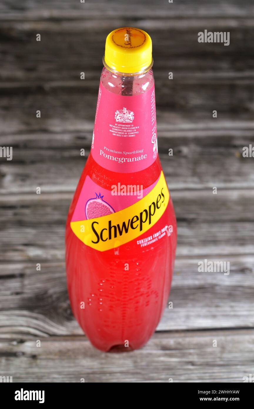 Cairo, Egypt, February 7 2024: Schweppes premium sparkling soft drink contains fruit pulp pomegranate flavor, Schweppes is a beverage brand that origi Stock Photo