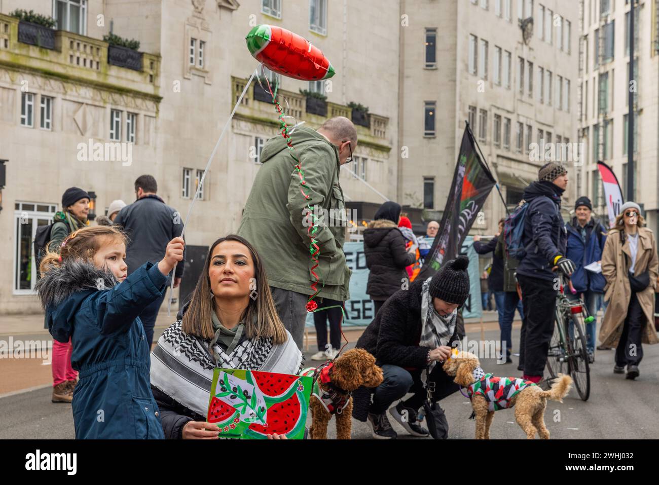 Leeds, UK. 10 FEB, 2024. Young child and mother attend Watermelon protest in city square . Credit Milo Chandler/Alamy Live News Stock Photo