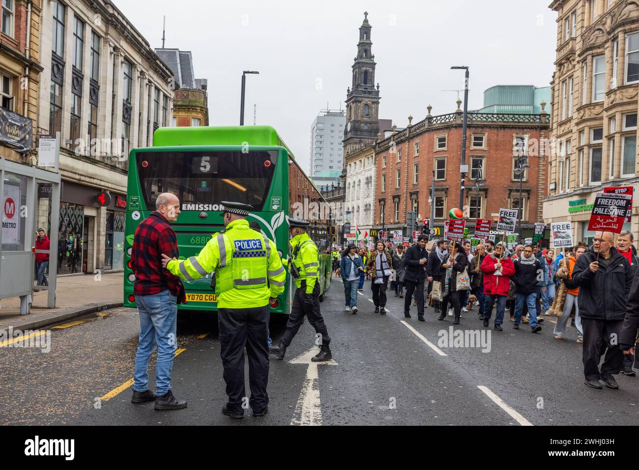 Leeds, UK. 10 FEB, 2024. Counter protestor argues with police while shouting towards Palestinian demonstrators marching through Leeds. Credit Milo Chandler/Alamy Live News Stock Photo
