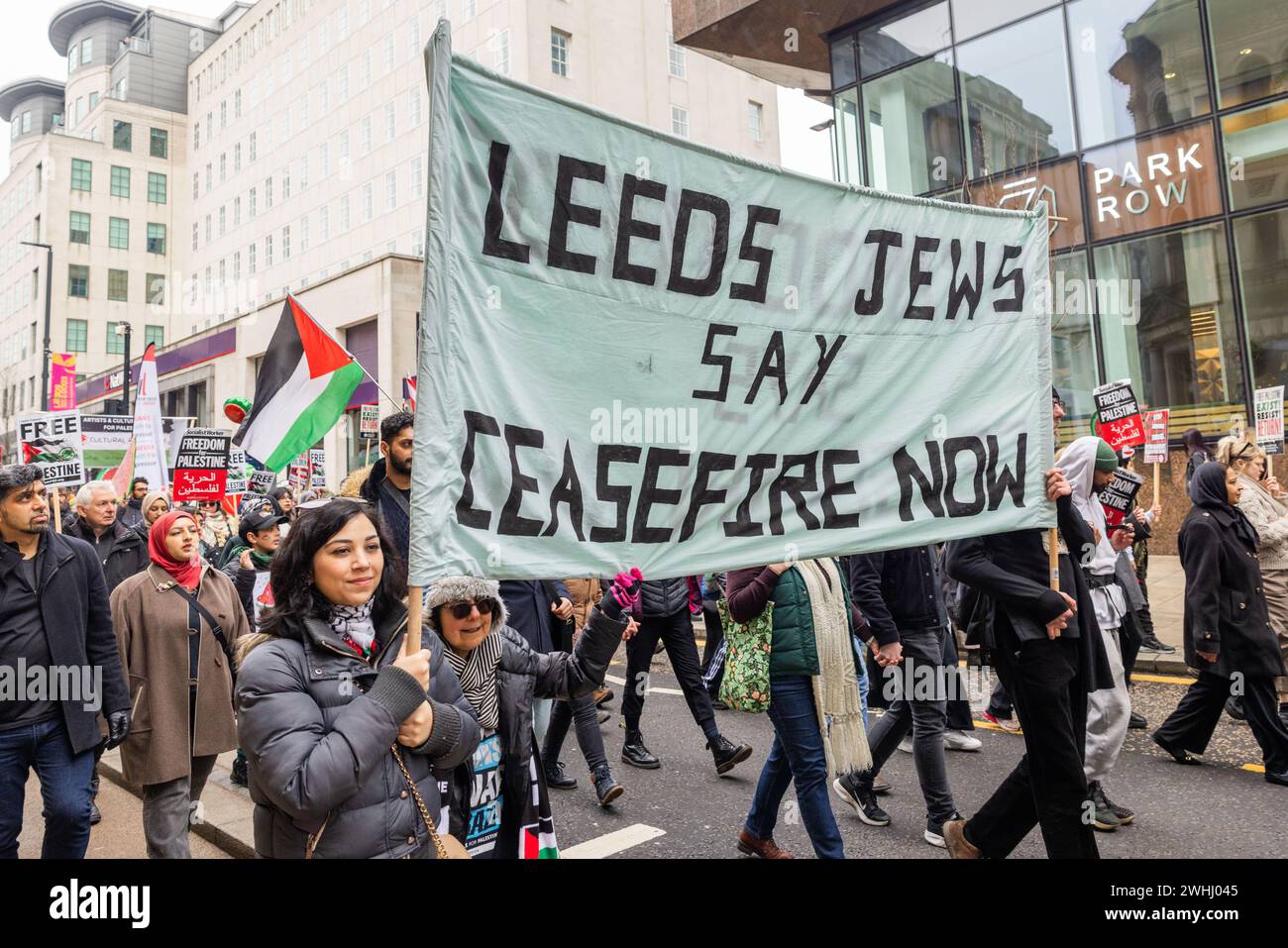 Leeds, UK. 10 FEB, 2024. Protestors carry 'Leeds Jews Say Ceasefire now' sign through the streets of Leeds as part of a wider Watermelon protestor. Credit Milo Chandler/Alamy Live News Stock Photo