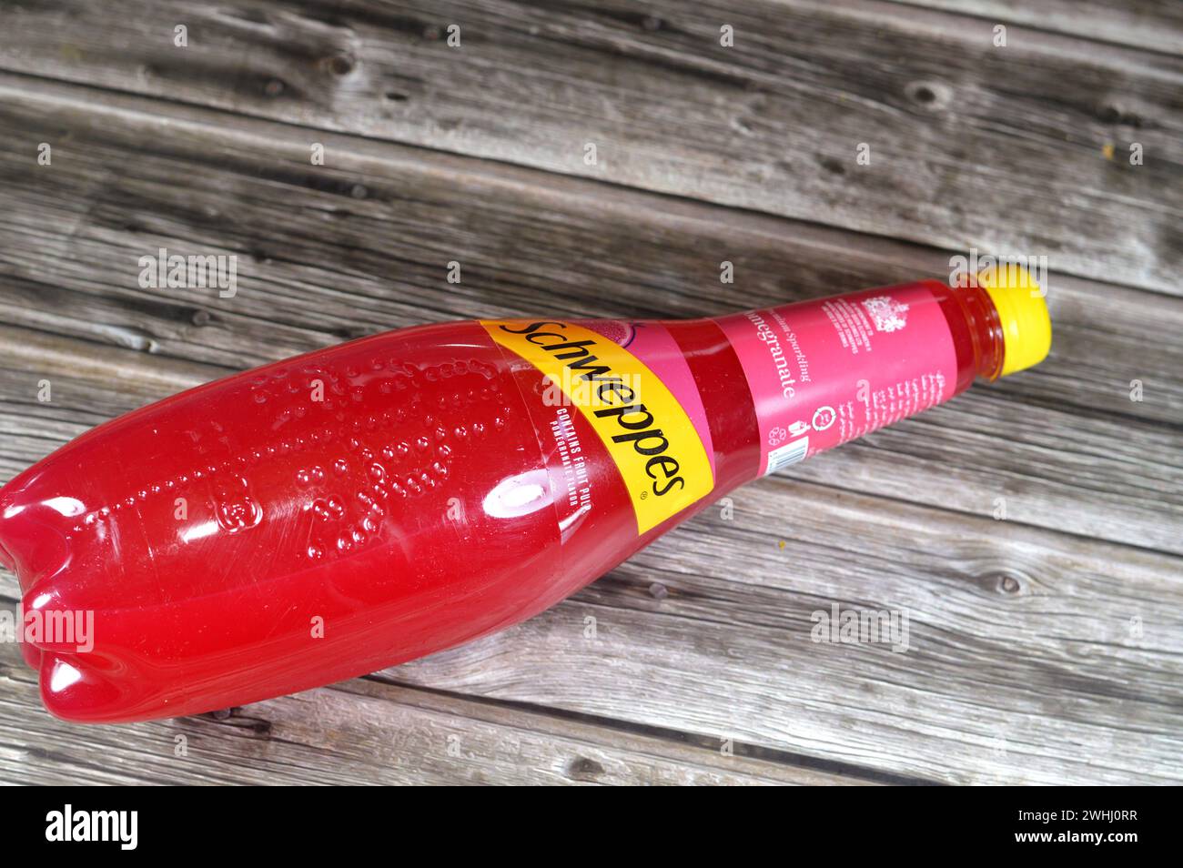 Cairo, Egypt, February 7 2024: Schweppes premium sparkling soft drink contains fruit pulp pomegranate flavor, Schweppes is a beverage brand that origi Stock Photo