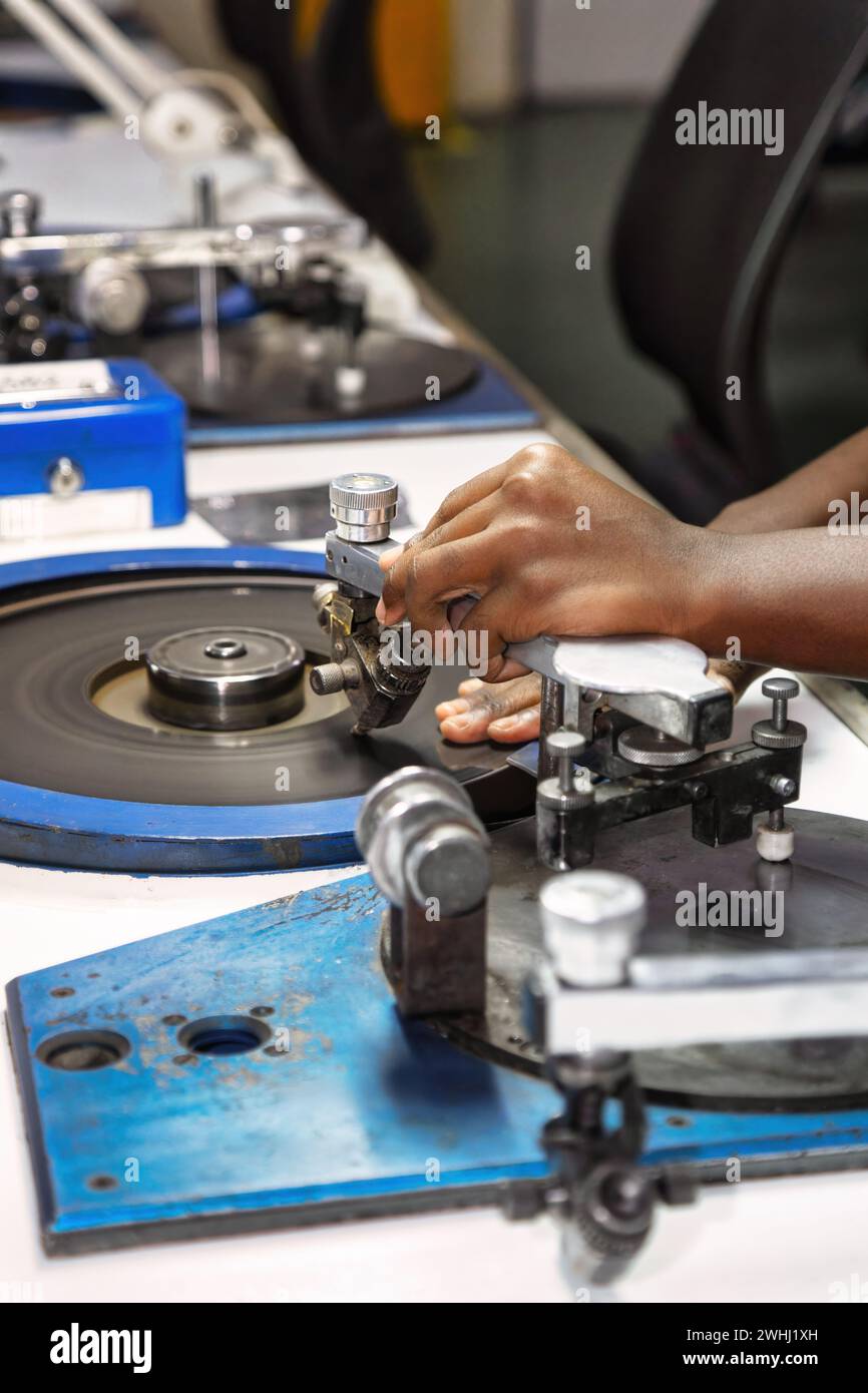 diamond polishers at work at the wheel in the diamond polishing factory Stock Photo