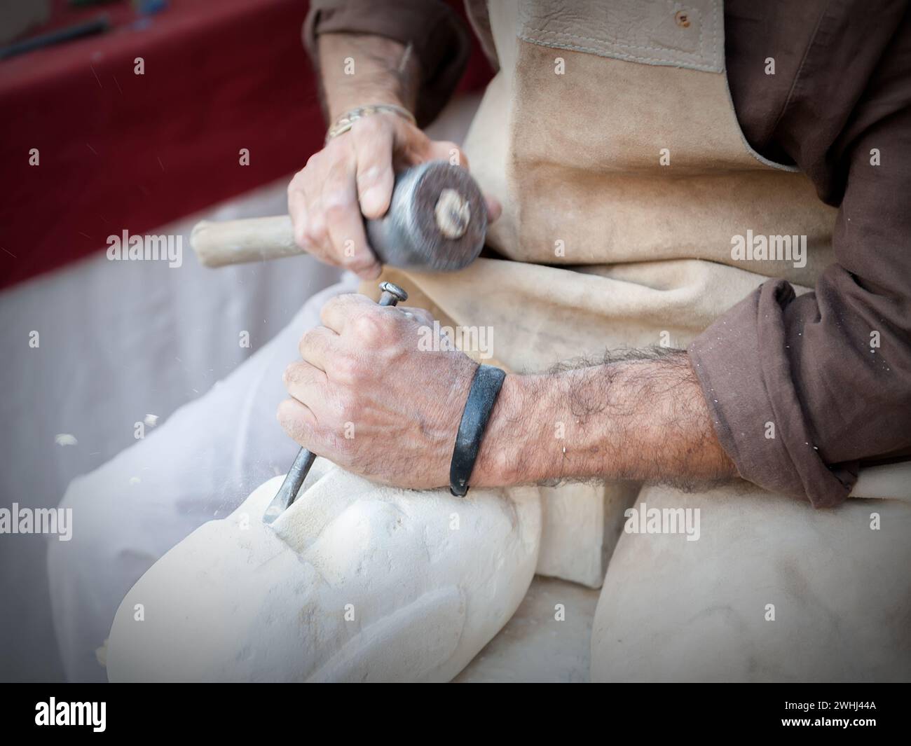 craftsman working on stone isolated on hands Stock Photo