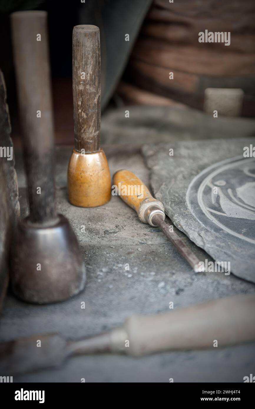 chisel and chisel craftsman isolated on wooden table Stock Photo
