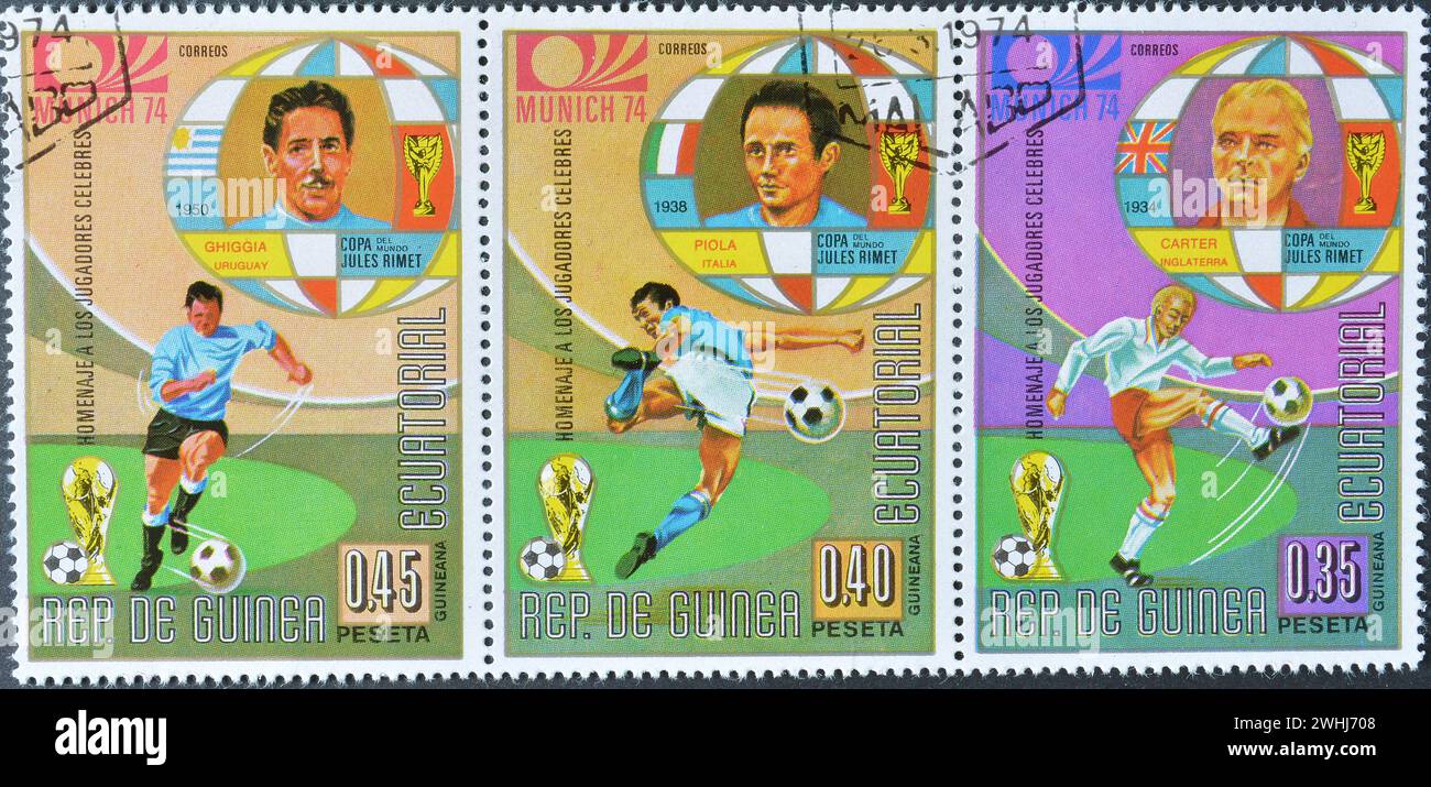 Cancelled postage stamps printed by Equatorial Guinea, that show football players Ghiggia,  Piola and Carter, World Cup Munich, Germany, circa 1974. Stock Photo