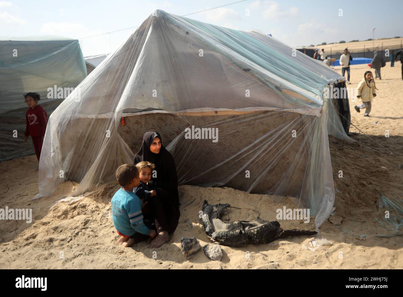 Rafah, Gaza. 09th Feb, 2024. A displaced Palestinian woman sits in ...