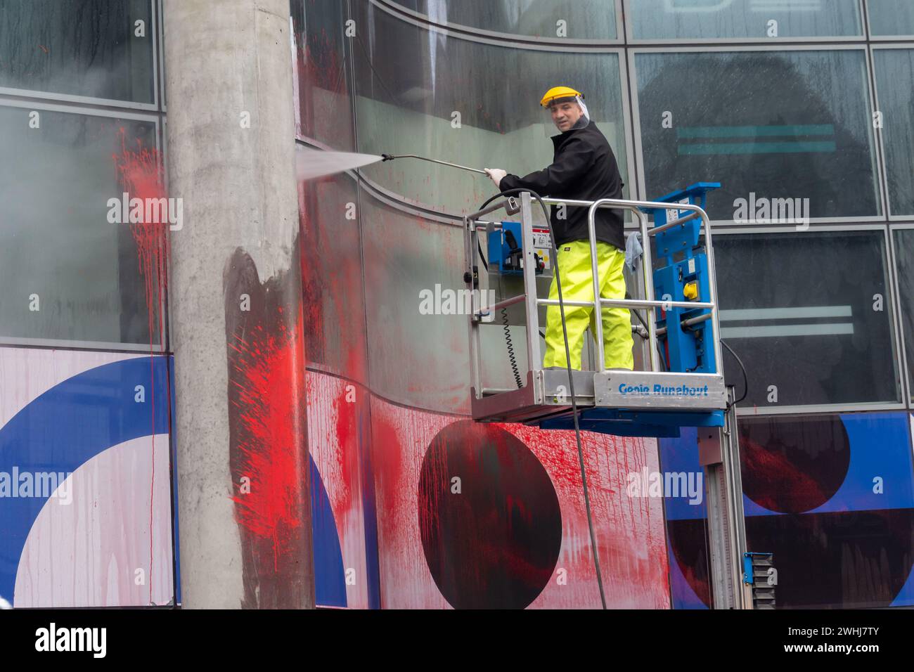 London, UK. 10 Feb 2024. When marchers calling for an end to the genocide in Israel arrived outside the office of BAE Systems in the Bluefin Building on Southwark St they found workers busy cleaning off red paint which had been sprayed earlier on the frontage. BAE provides Israel with key components of fighter jets, munitions, armoured vehicles and missile launching kits which have now killed 28,000 mainly women and children in Gaza. Protesters are calling for the UK to stop to supplying arms to Israel. Peter Marshall/Alamy Live News Stock Photo