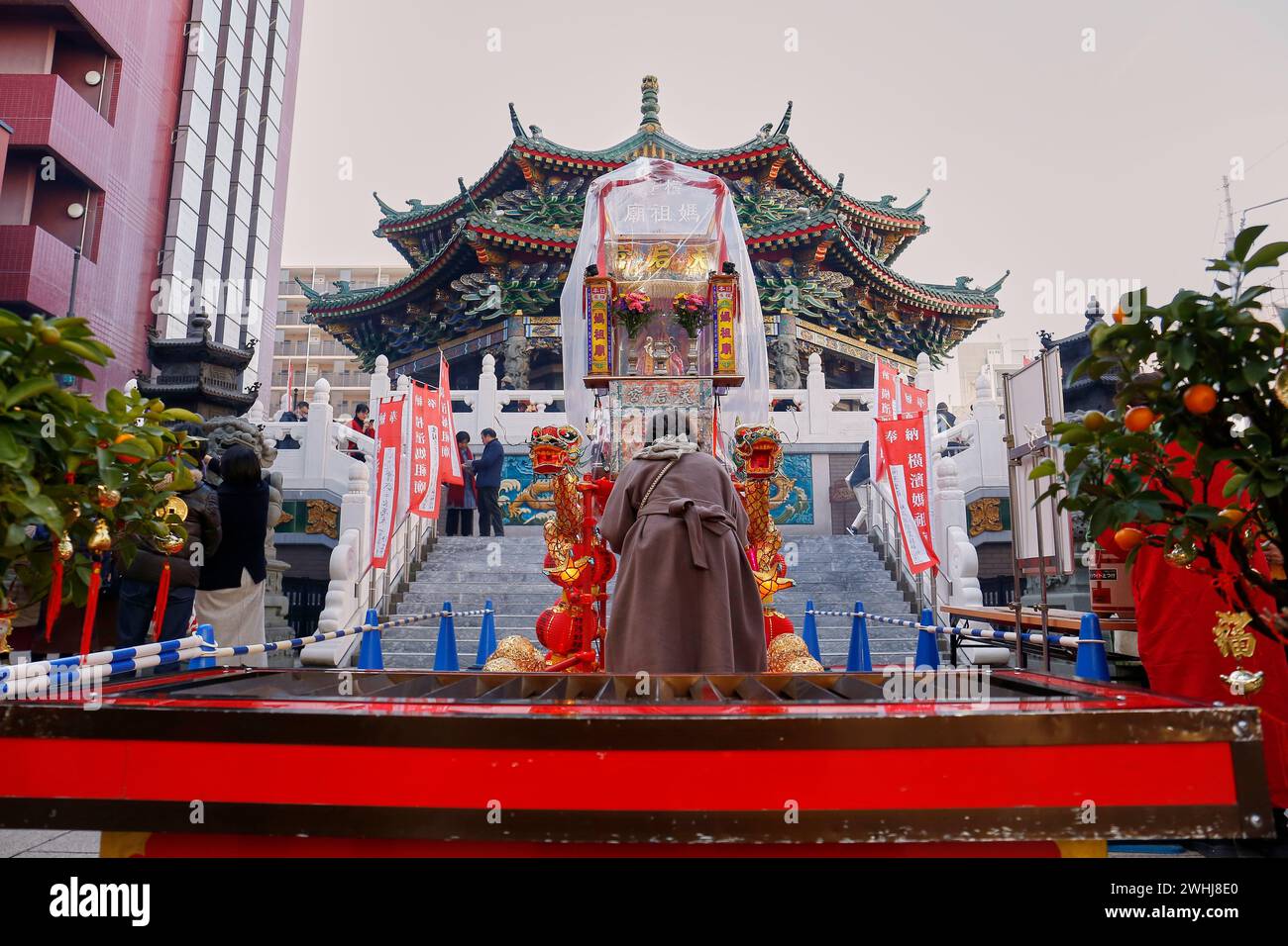 Yokohama, Japan. 10th Feb, 2024. A woman visits Kanteibyo Temple during the Lunar New Year celebrations in Yokohama Chinatown. The Chinese New Year Festival organized in Yokohama celebrates the Lunar New Year or Spring Festival, events are held from February 10 to 24. (Credit Image: © Rodrigo Reyes Marin/ZUMA Press Wire) EDITORIAL USAGE ONLY! Not for Commercial USAGE! Stock Photo