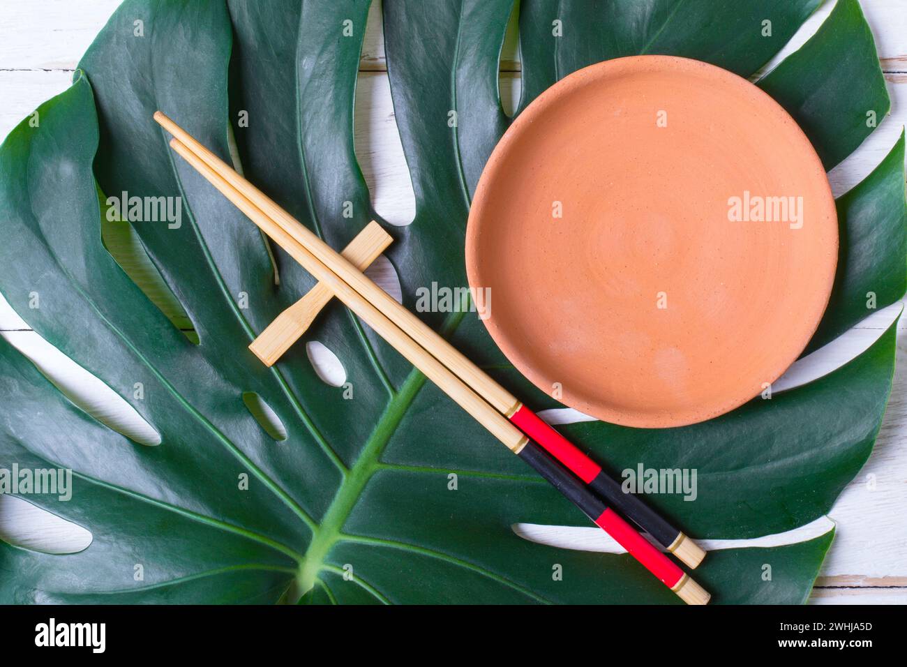 Chopstick and ceramic handmade dish. Asian food concept. Stock Photo