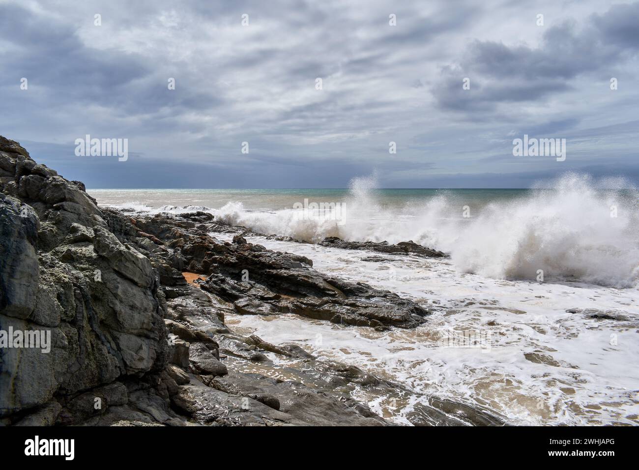 The angry Atlantic Ocean after a few days of the storm with cloudy water Stock Photo