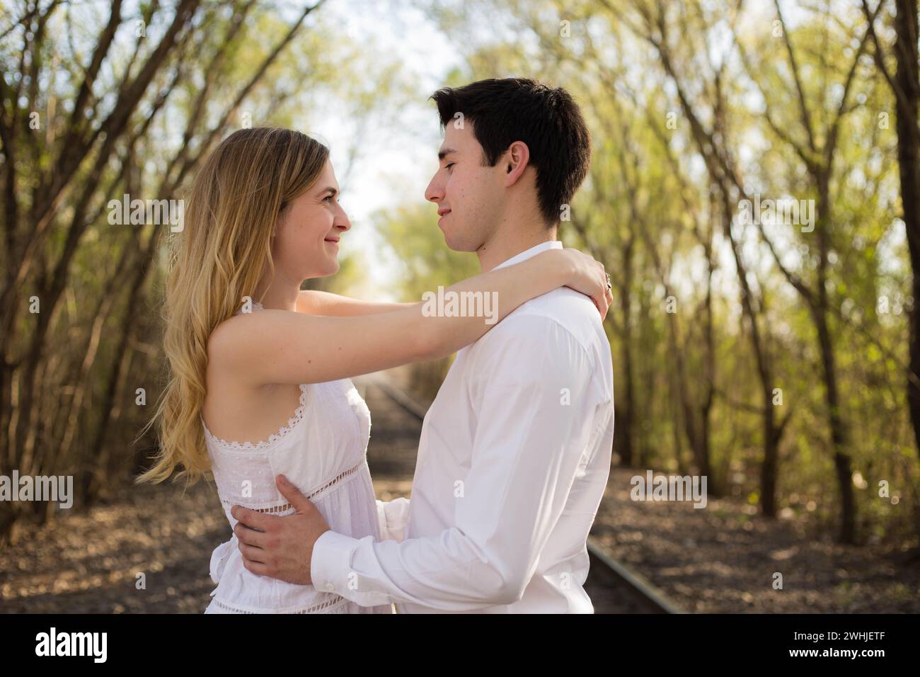 Young man hugging trees forest hi-res stock photography and images - Alamy