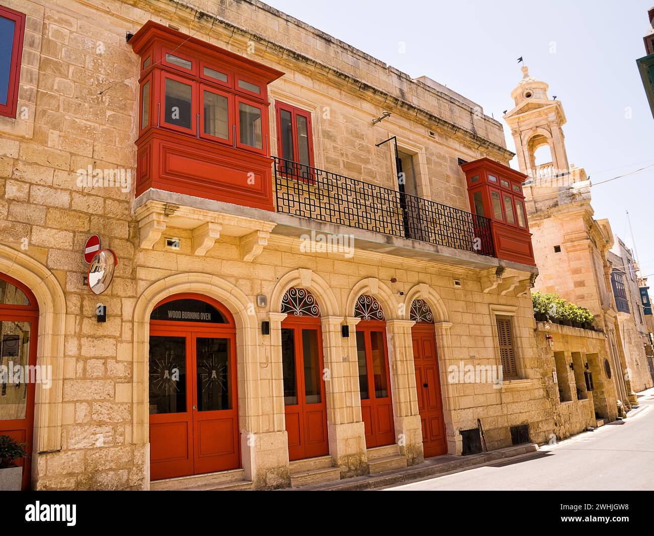 Gallarija, closed balconies, typical of Malta, and bell tower of the church of Santa Maria di Doni Stock Photo