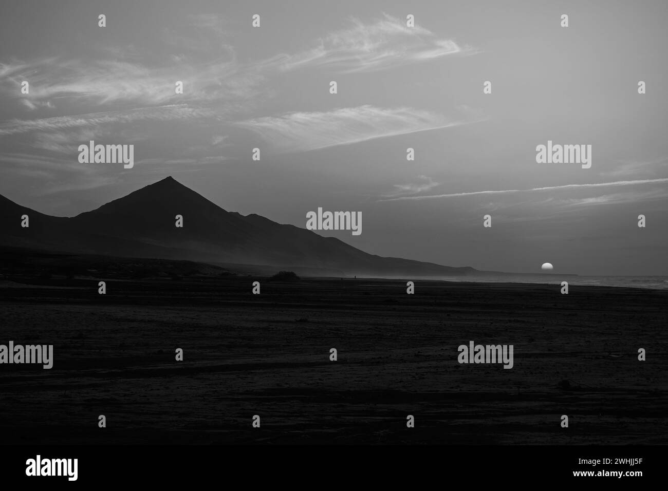 Sunset on Cofete beach in Fuerteventura in Jandia Natural Park with silhouettes and Stock Photo