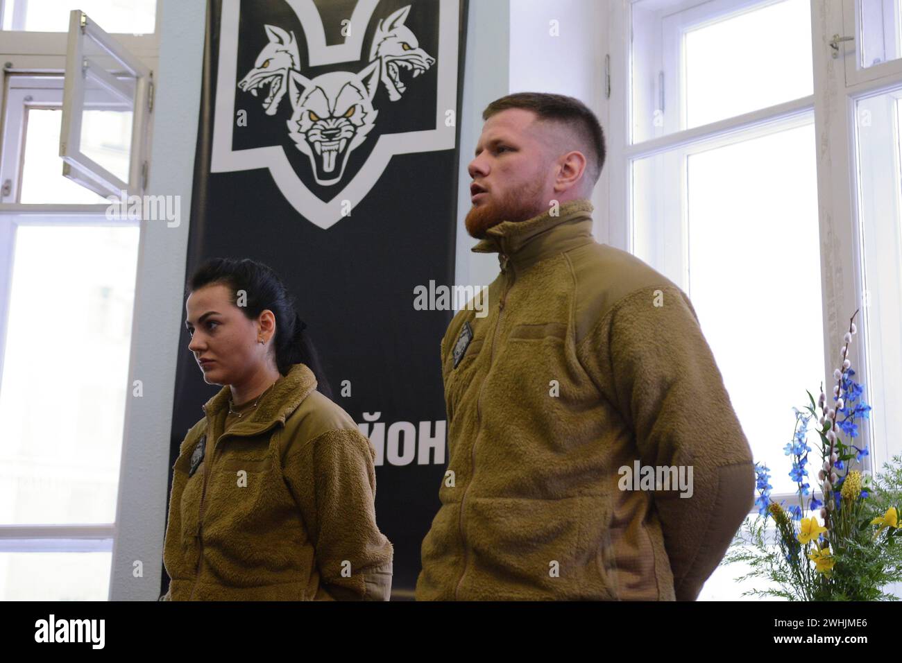 Serhiy Filimonov (call sign Filya) (R), and Alina Mykhaylova (L) are officers of the Armed Forces of Ukraine signed to the 'Da Vinci Wolves' battalion are seen during the opening of the recruiting center for the recruitment of volunteers. Fighters of the 'Da Vinci Wolves' battalion announced the opening of a recruiting center for the recruitment of fighters to resist Russia's military aggression in Kyiv. Stock Photo