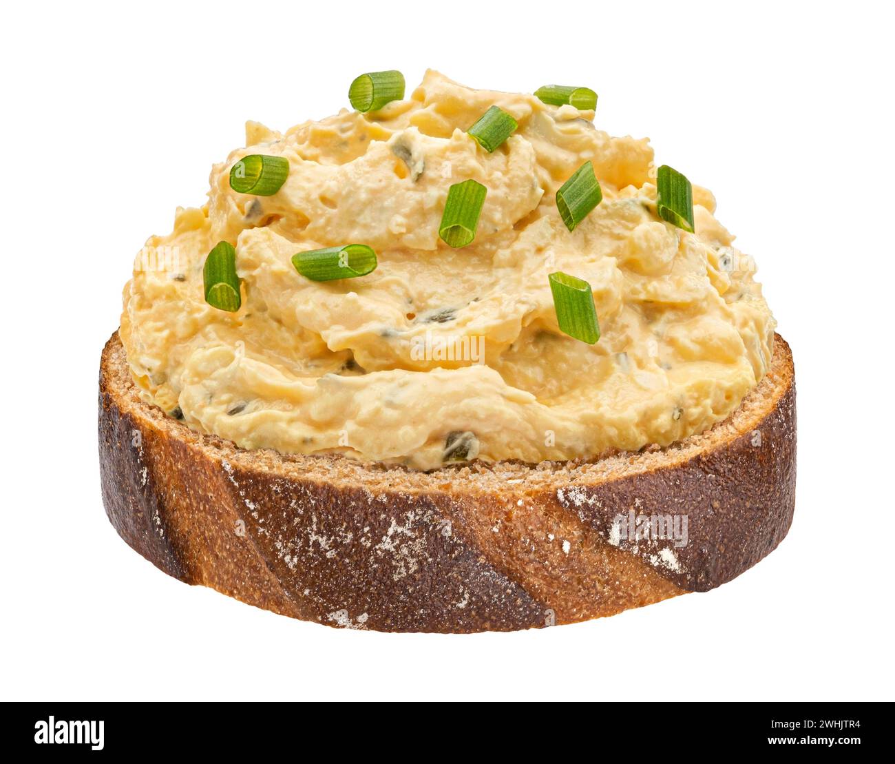 Egg spread with onion and chives on rye bread isolated on white background Stock Photo