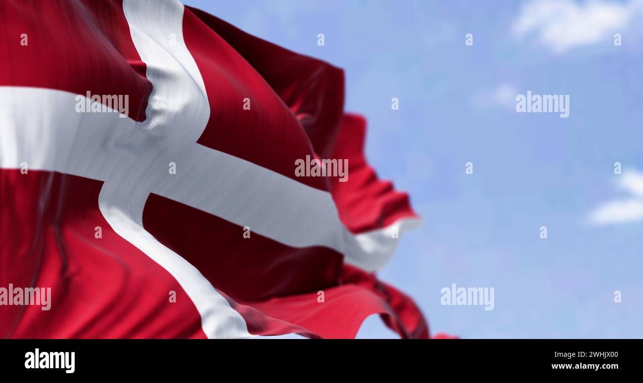 Denmark national flag waving in the wind on a clear day Stock Photo