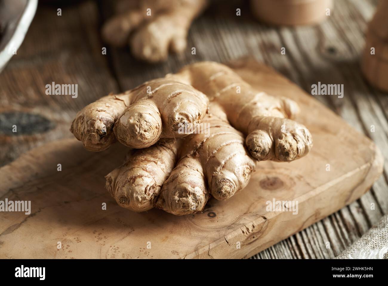 Fresh ginger root on a wooden cutting board Stock Photo