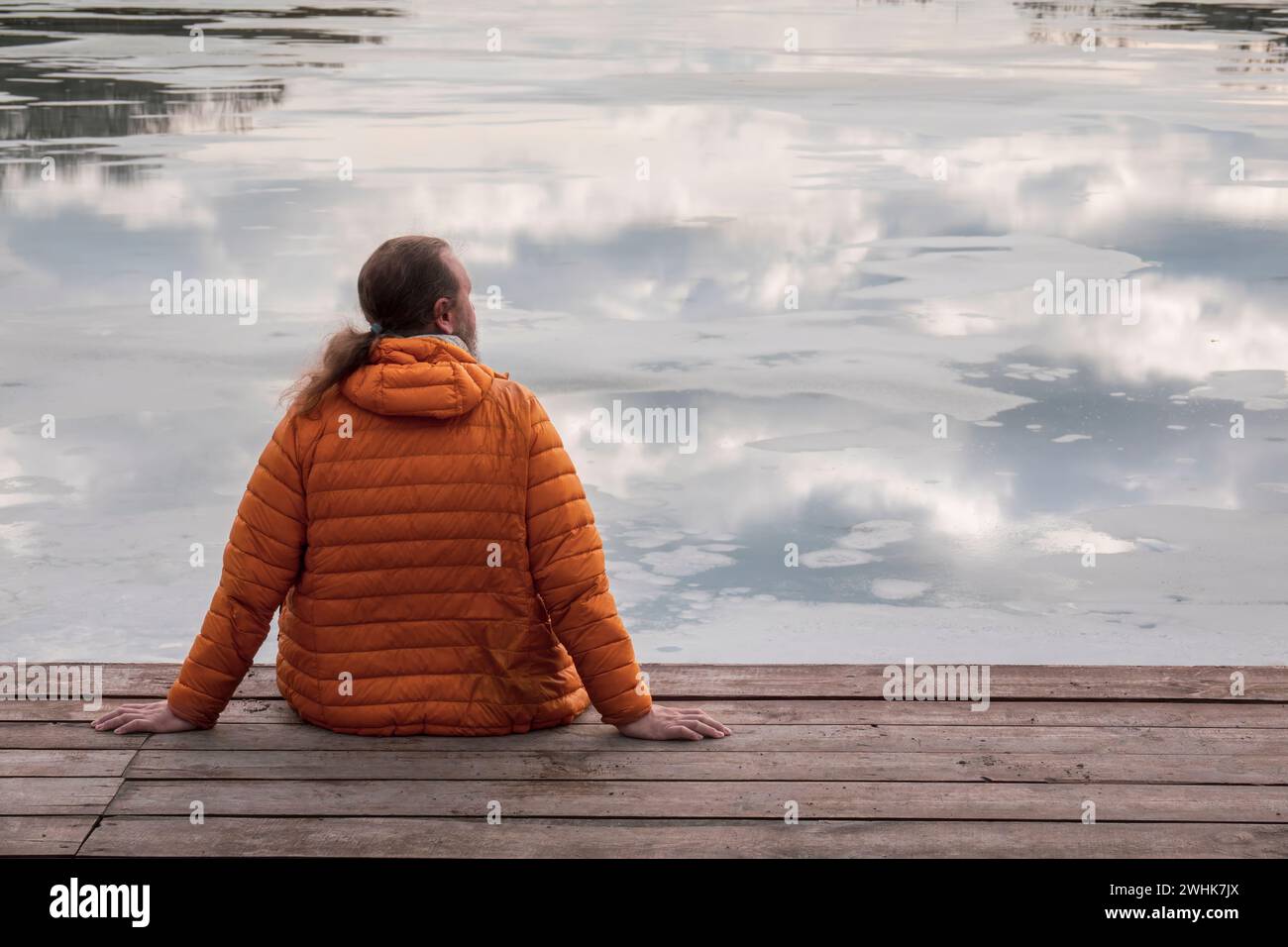 Person in orange jacket hi-res stock photography and images - Alamy