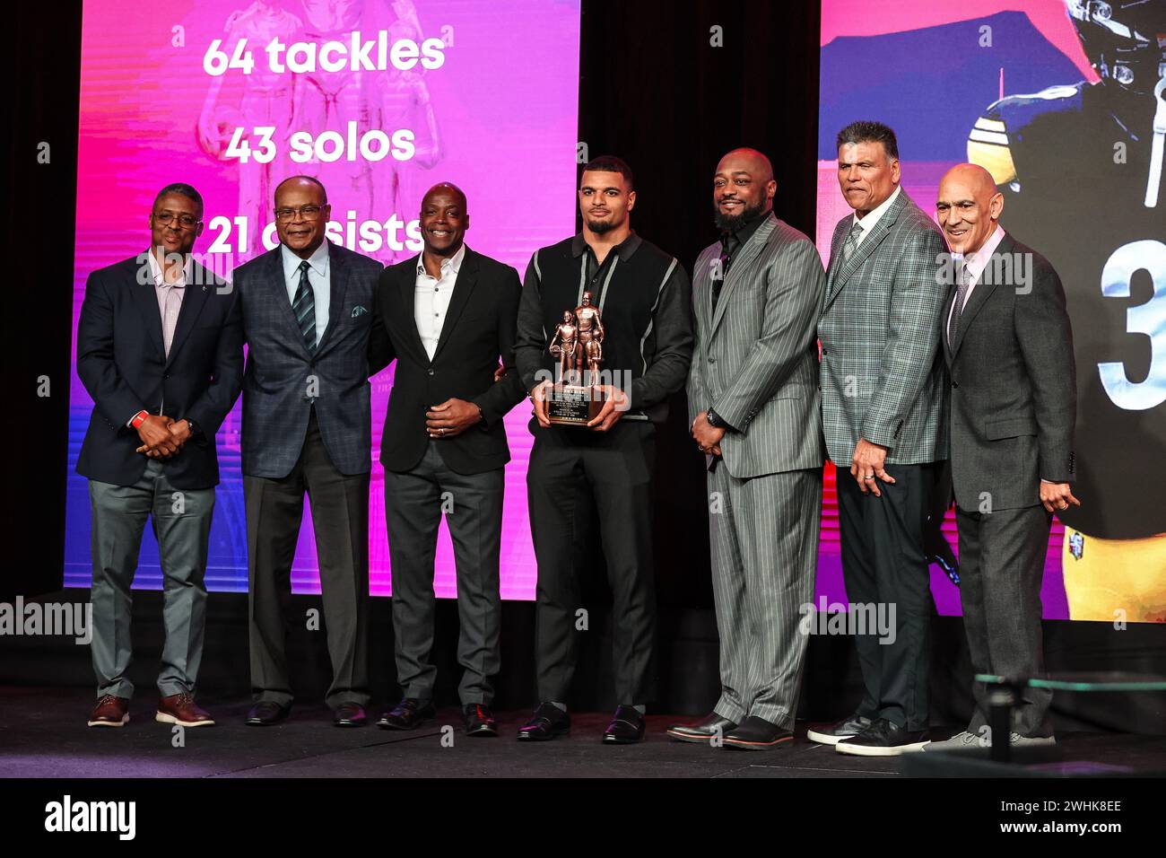 Las Vegas, NV, USA. 10th Feb, 2024. Pittsburgh Steelers Minkah Fitzpatrick (center) poses with the Bart Starr Award and past recipients on stag during the Super Bowl Breakfast held at Caesars Palace in Las Vegas, NV. Christopher Trim/CSM/Alamy Live News Stock Photo