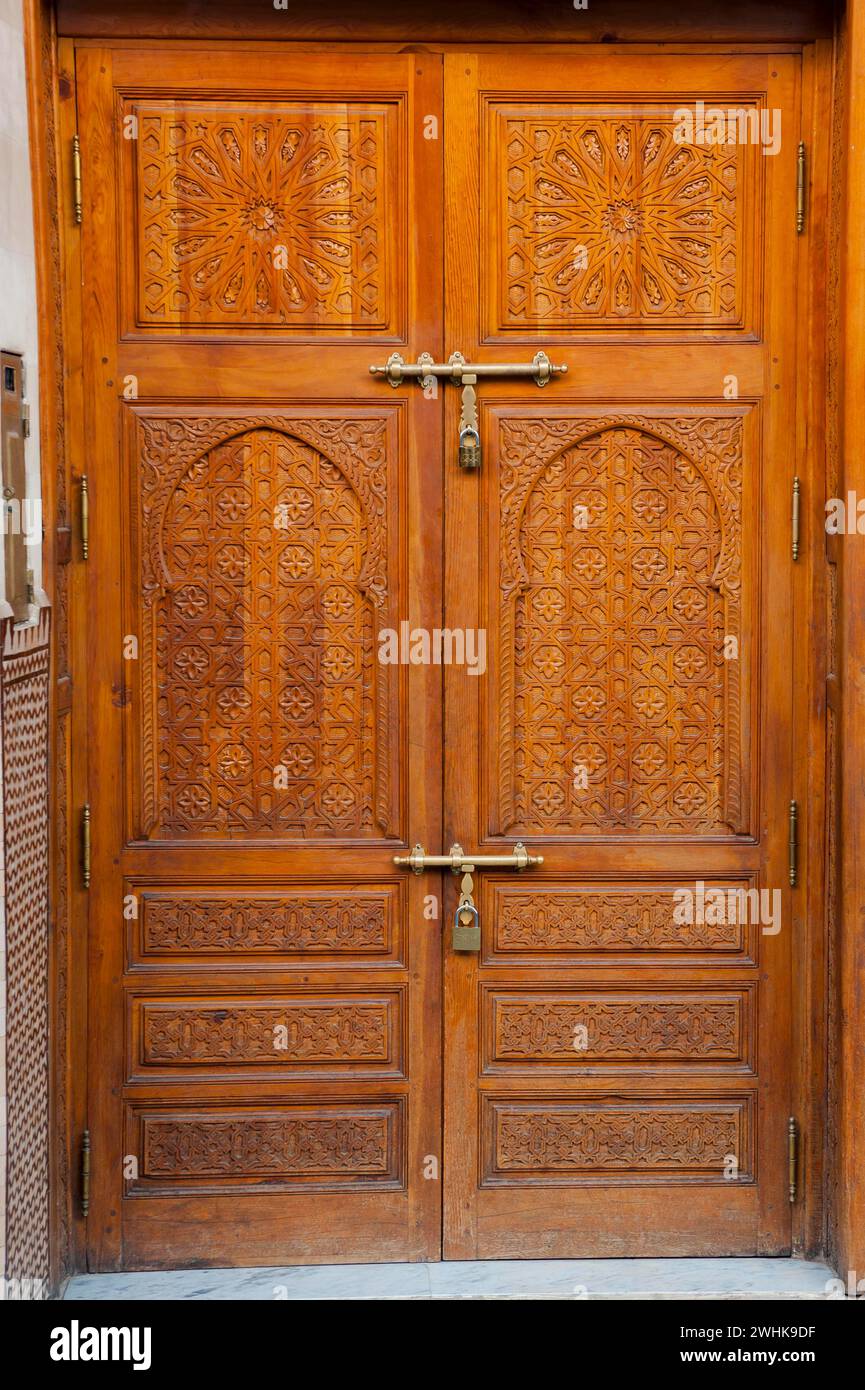Traditional wooden door with inlays, wooden door, arabic, oriental, entrance, entrance door, splendid, craft, craftsmanship, art, architecture Stock Photo
