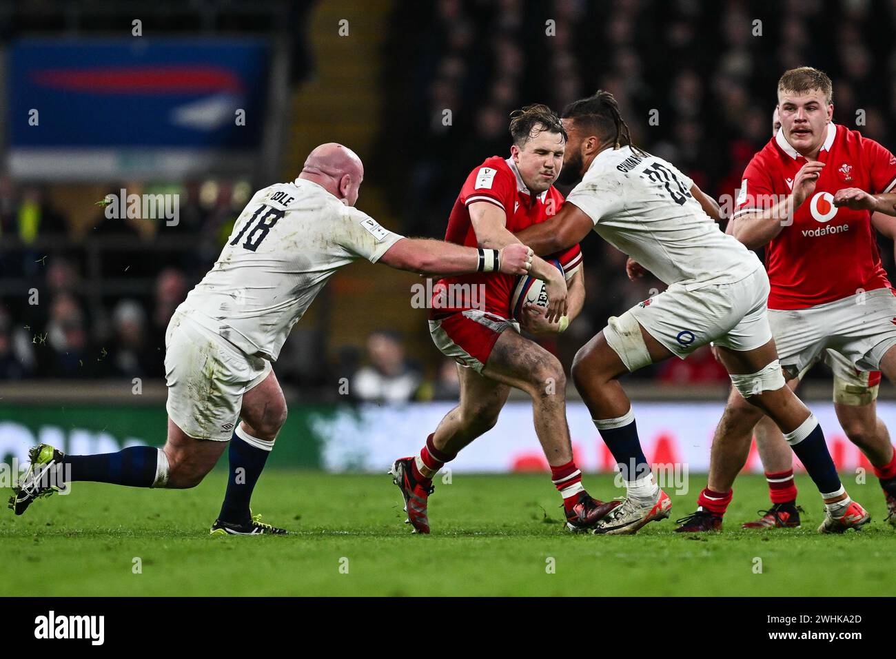 Ioan Lloyd of Wales is tackled by Chandler Cunningham-South of England and Dan Cole of England during the 2024 Guinness 6 Nations match England vs Wales at Twickenham Stadium, Twickenham, United Kingdom, 10th February 2024  (Photo by Craig Thomas/News Images) Stock Photo