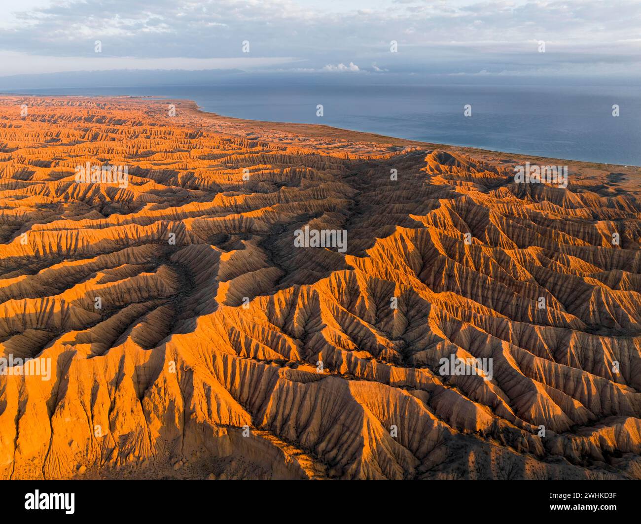 Landscape of eroded hills at Lake Issyk Kul, Badlands at sunrise ...