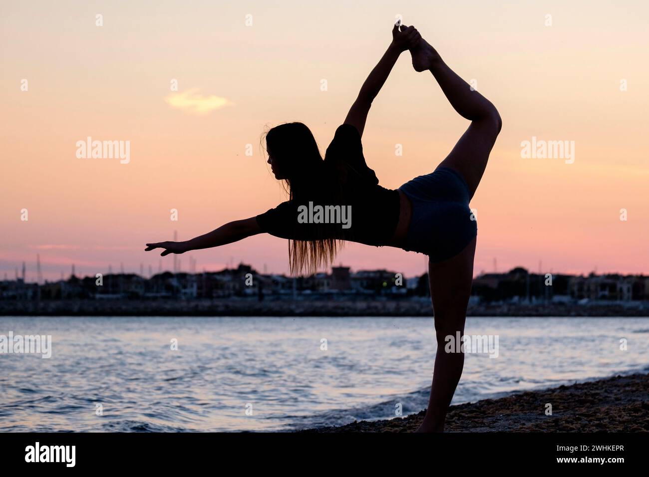 Young woman practising yoga Stock Photo