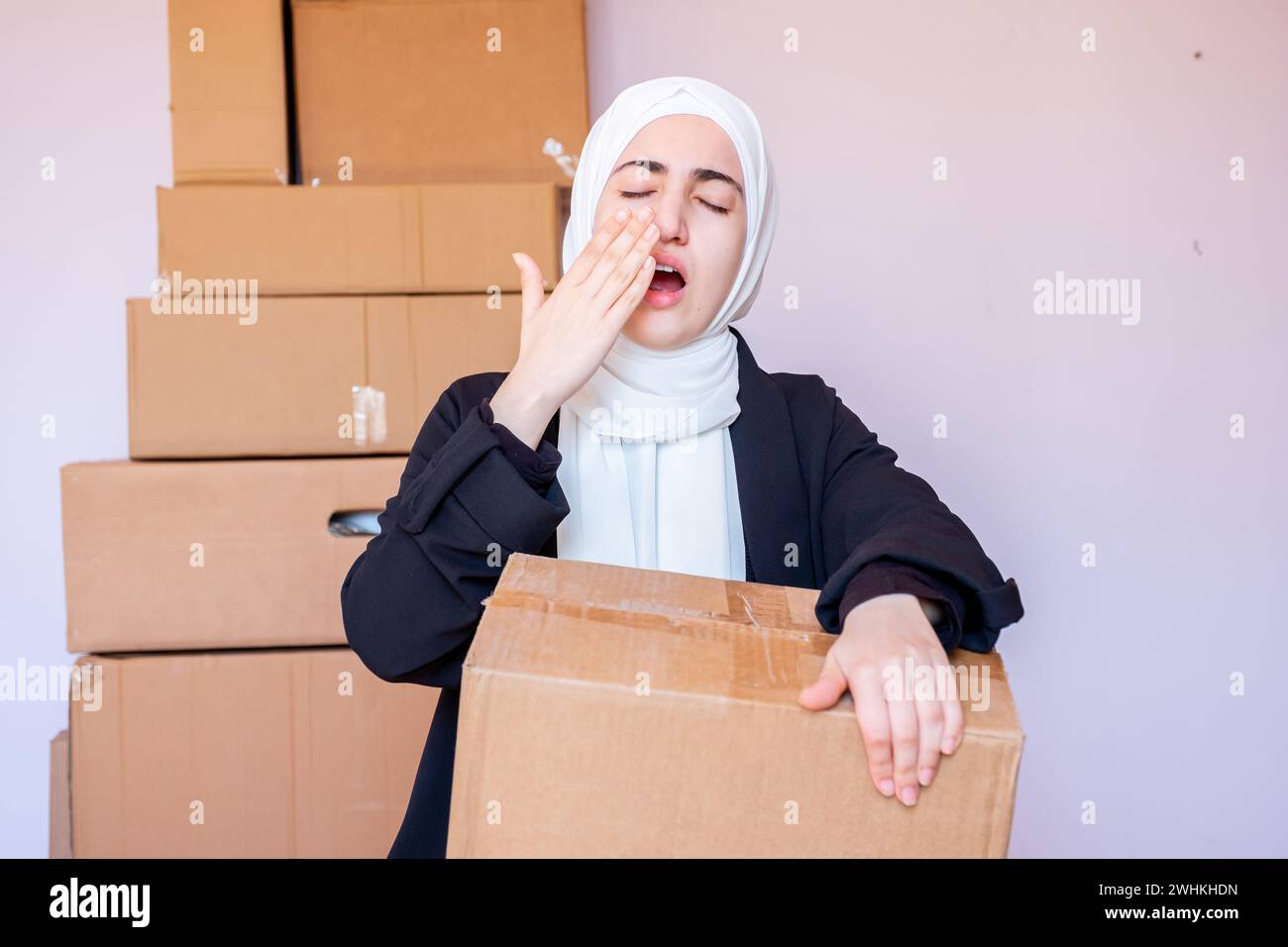 Arabic muslim woman feeling sleepy after long hard day Stock Photo