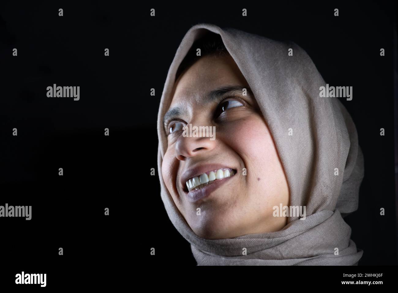 portrait for muslim women on black background in studio with facial expressions Stock Photo
