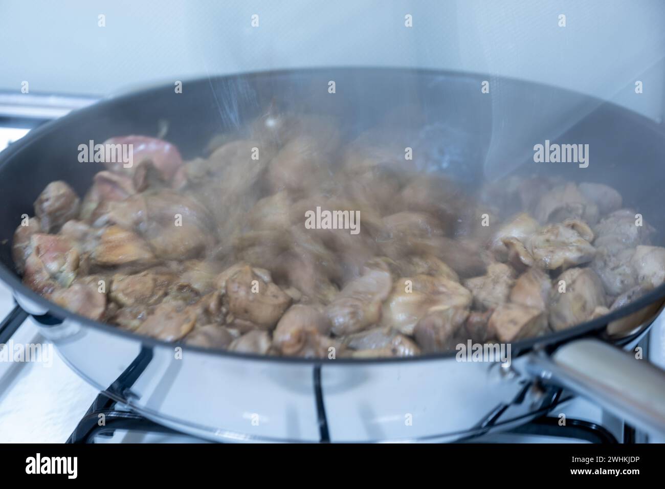 pan full of chicken livers and gizzards Stock Photo Alamy