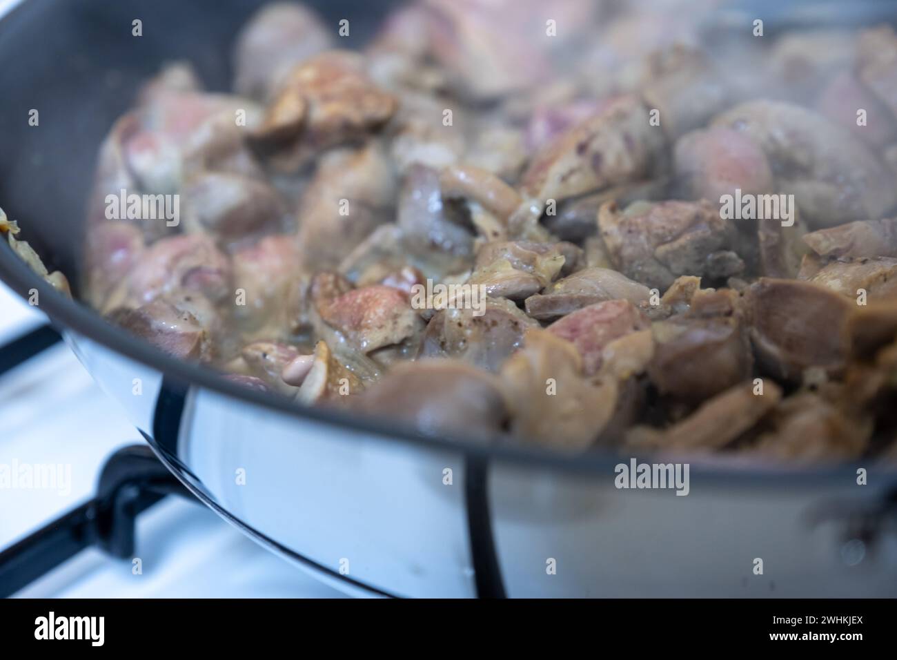 pan full of chicken livers and gizzards Stock Photo Alamy