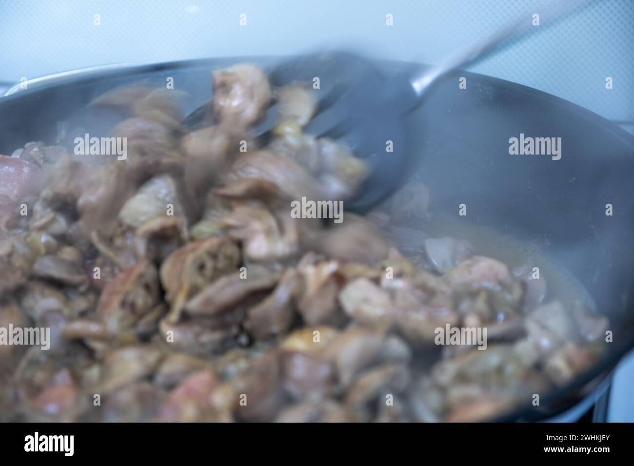 pan full of chicken livers and gizzards Stock Photo Alamy