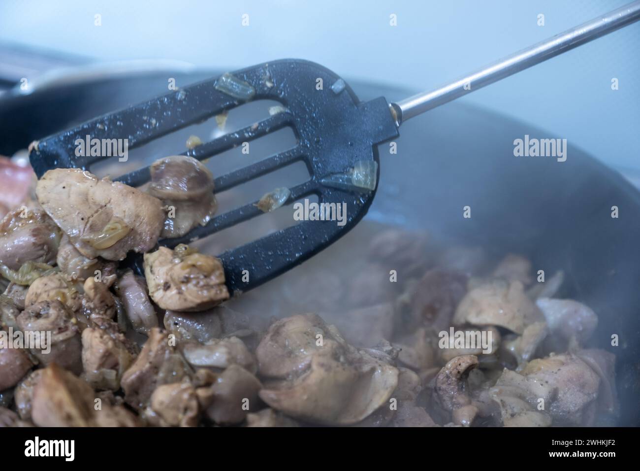 pan full of chicken livers and gizzards Stock Photo Alamy
